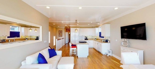 Coastal-themed beachfront home with water views, grill, & beach access in Seal Beach