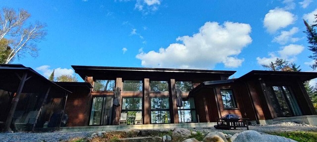 Expansive Lakefront modern retreat nestled by nature, huge windows ,4 bedroom in Nominingue