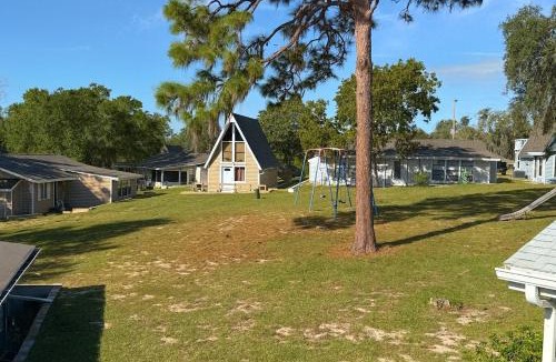 Vacation Village House | Hook's Cabin- Lake & Pool near Disney A-frame